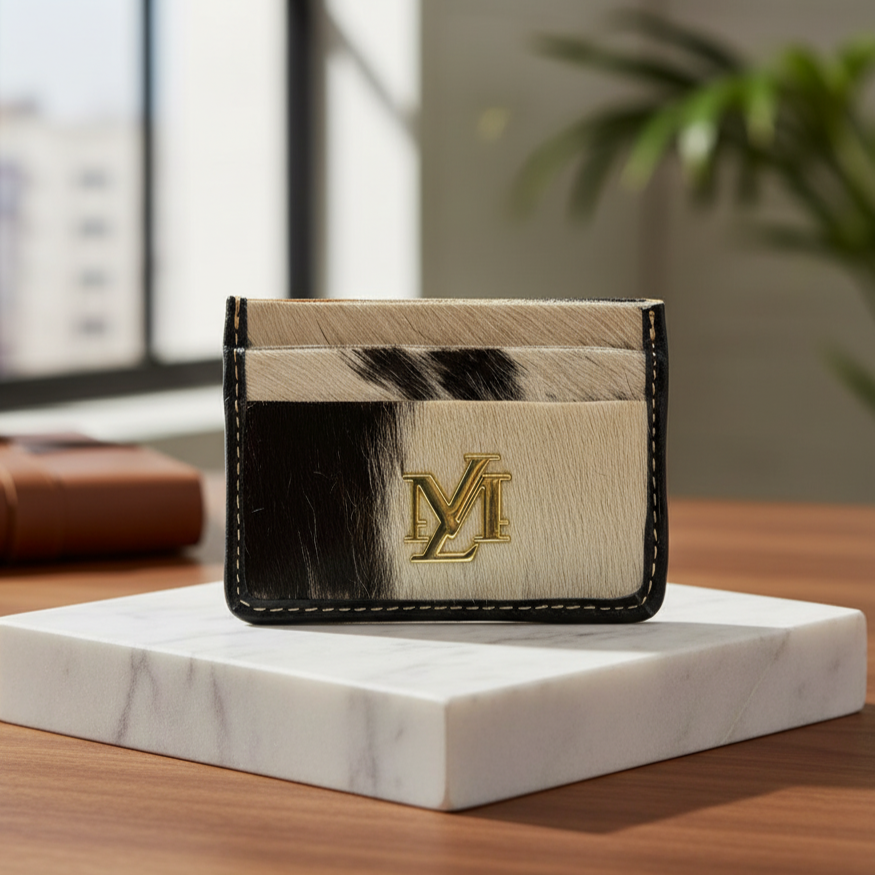 Cardholder with cowhide design and logo on a marble stand, blurred office background
